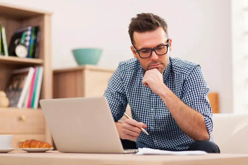 Business man reviewing costs